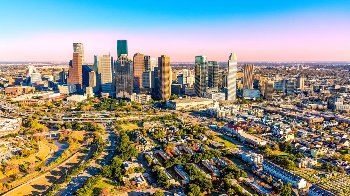 An aerial view of the downtown skyline and surrounding metropolitan area of Houston.