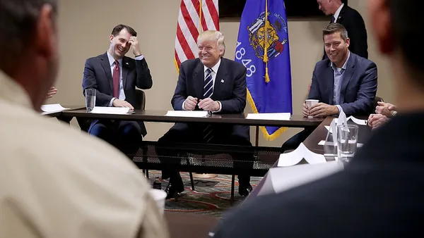 President-elect Donald Trump joined Wisconsin's then-Gov. Scott Walker and then-Rep. Sean Duffy for a small business roundtable in Altoona in 2016.