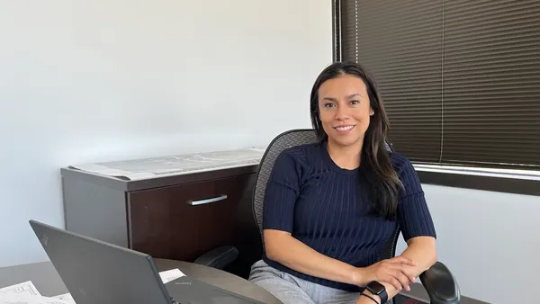 a woman sitting at a desk