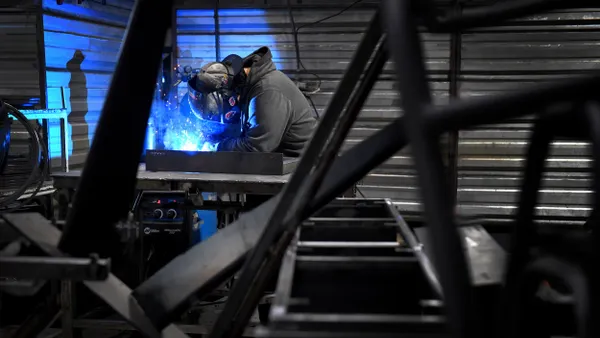 A person wearing a helmet while welding