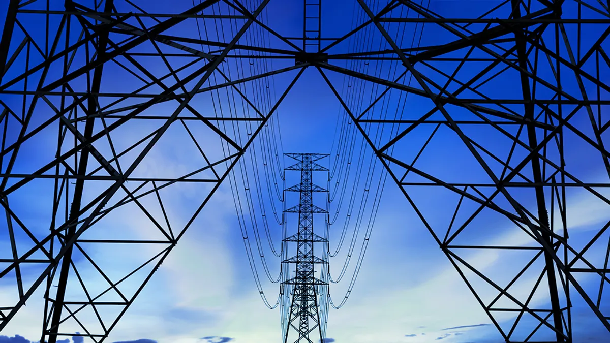 Silhouette image. High voltage tower and Blue sky