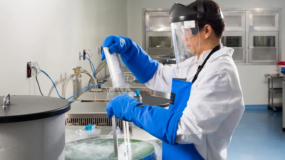 An employee handles product in Gilead's cell therapy unit.
