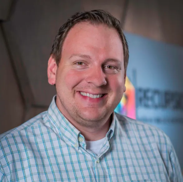A portrait of Chris Gibson, Recursion Pharmaceuticals' CEO.