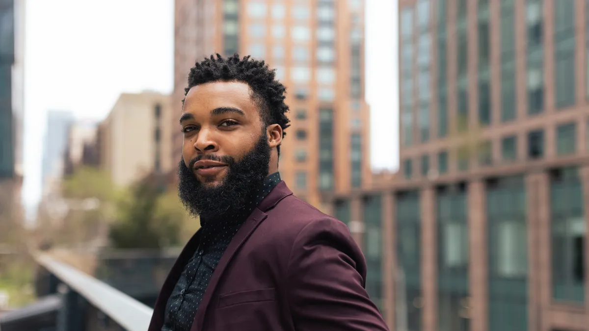 Black businessman in front of the office building