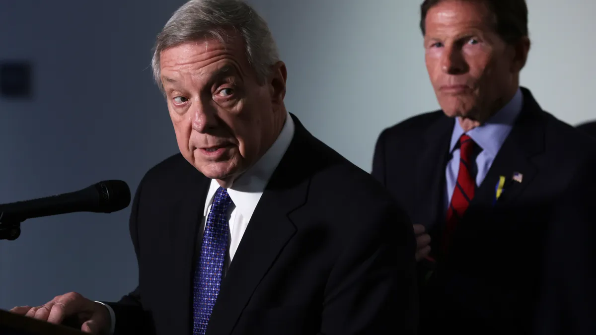 Sen. Richard Blumenthal, D-Conn., listens as Sen. Richard Durbin, D-Ill., speaks during a news conference after a hearing on gun violence on Capitol Hill on June 7, 2022.