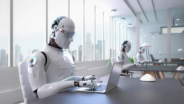 AI robots type on computers in office setting.