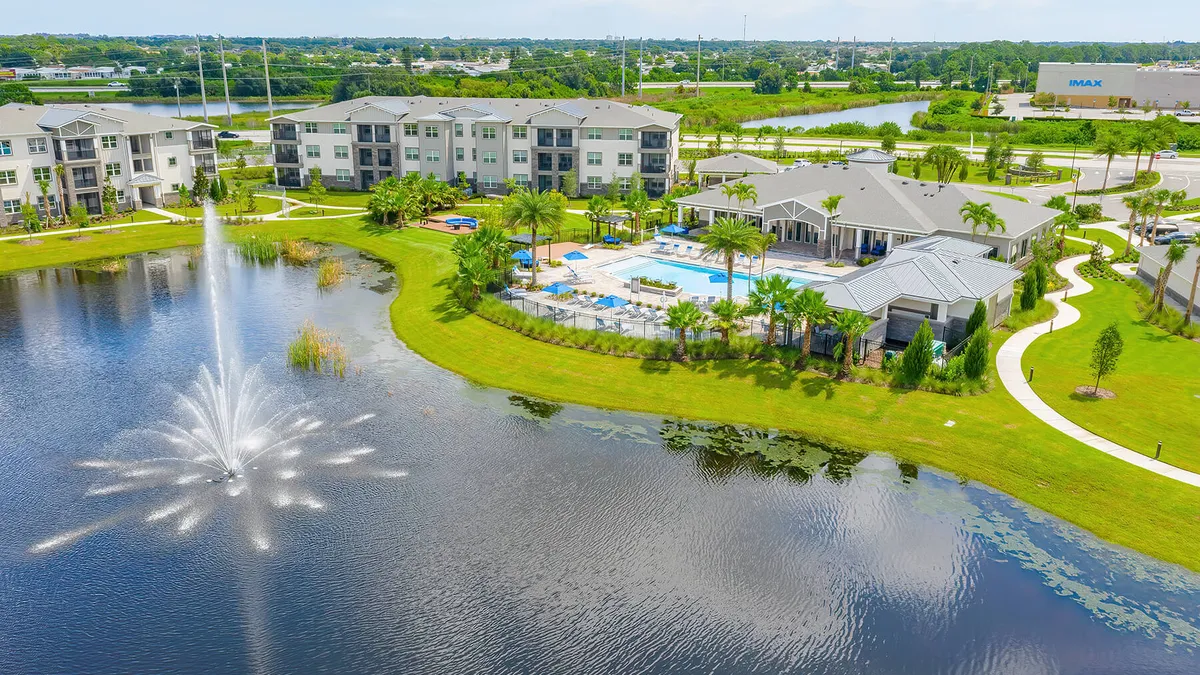 Apartment property next to a body of water.