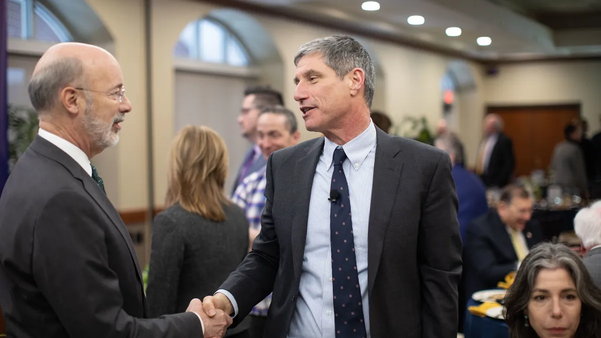 Gov. Tom Wolf talks with PASSHE Chancellor Daniel Greenstein