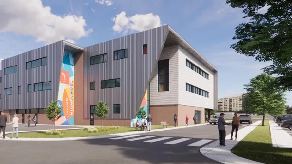 A rendering of a new building on a bright blue day, low-ish to the ground and modern.