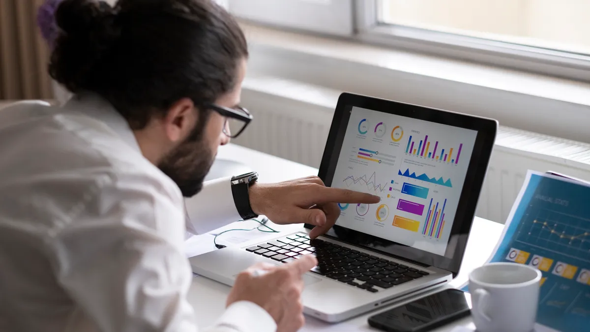 Businessman working on Financial Report of corporate operations, balance - stock photo