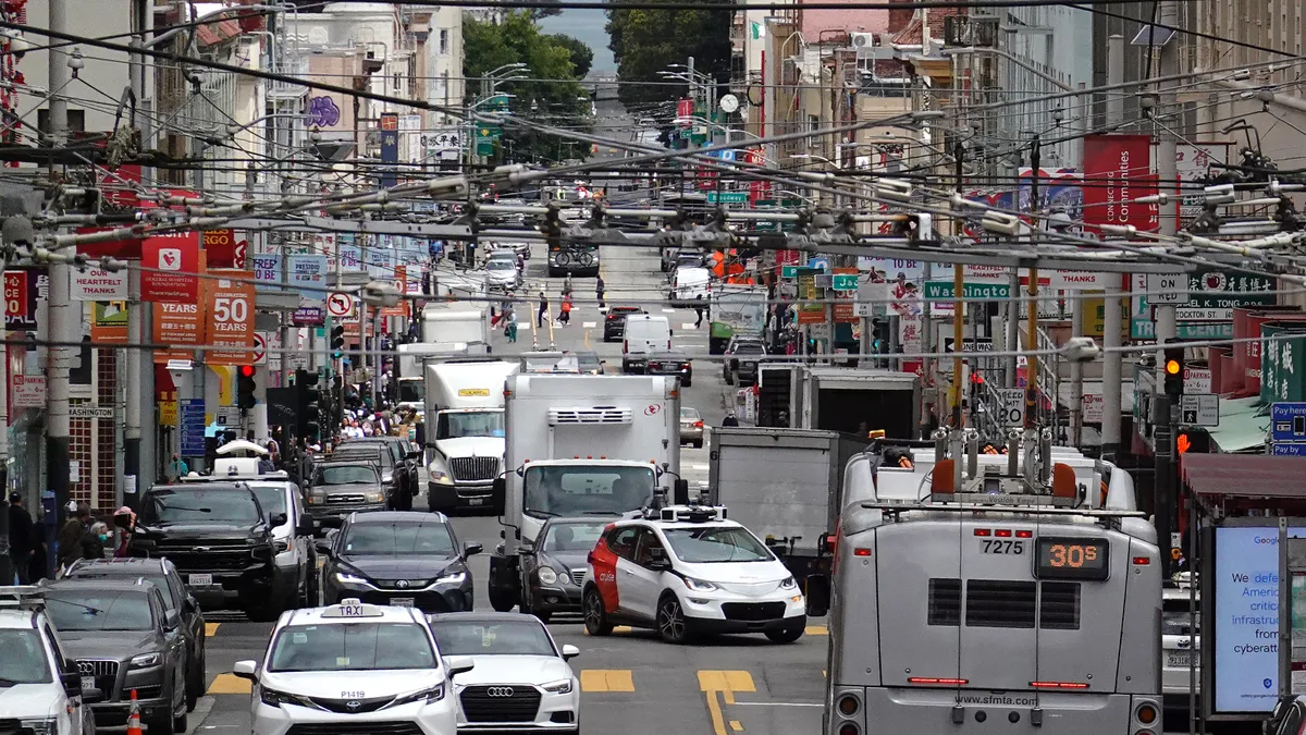 A Chevrolet Cruise autonomous vehicle with a driver moves through an intersection on June 08, 2023 in San Francisco, Californi