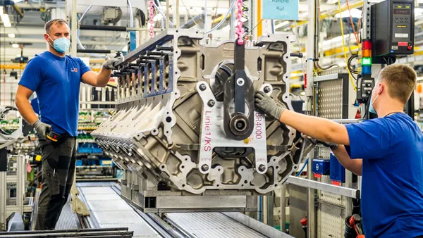 Rolls-Royce employees work on a 4000 Series engine.