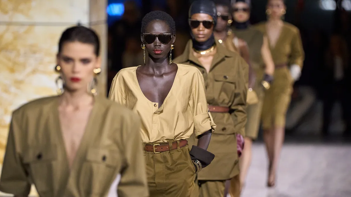 A close-up of models as they walk the runway wearing neutral tones of brown during the Saint Laurent Womenswear spring-summer 2024 show as part of Paris Fashion Week.