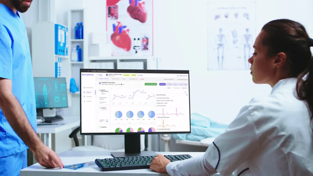 Clinical investigators review cardiopulmonary assessments by Nanowear’s Simplesense device.