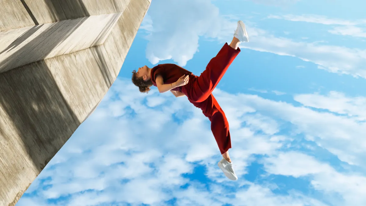 A person in midair for an Allbirds campaign