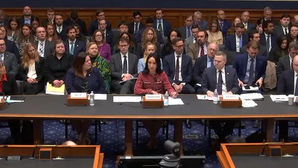 People sit at a large table.