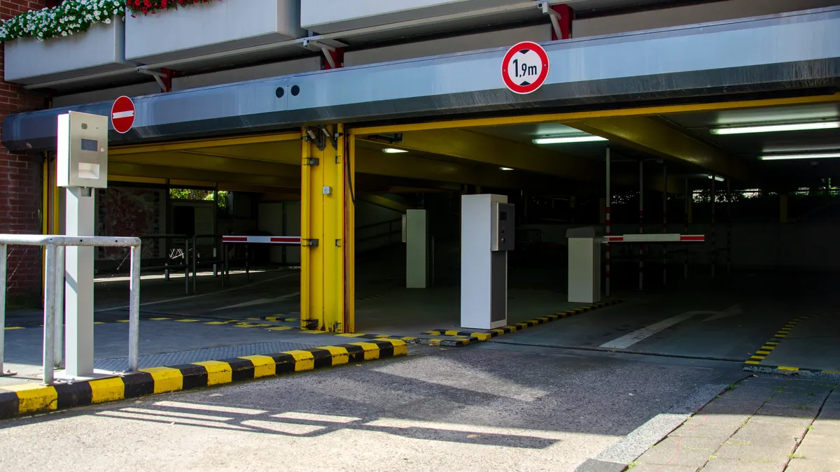 An entrance to a parking lot