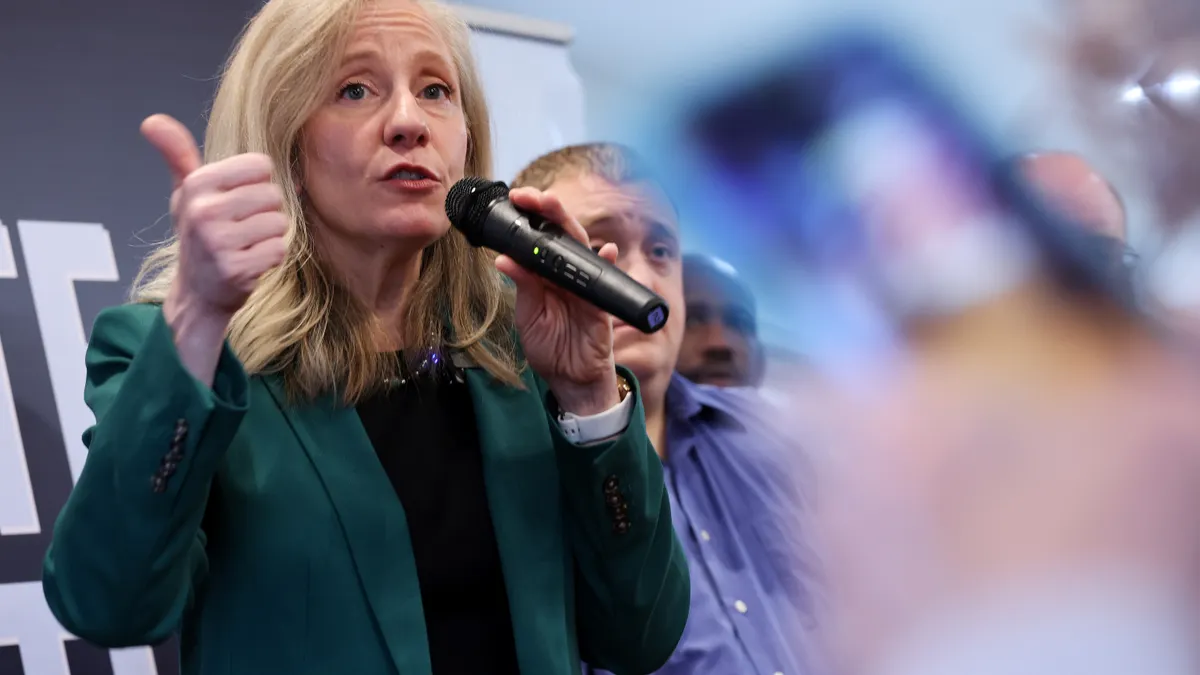 Governor-elect Abigail Spanberger speaks to supporters during a campaign bus tour stop at Railway Cafe on October 28, 2025 in Winchester, Virginia.