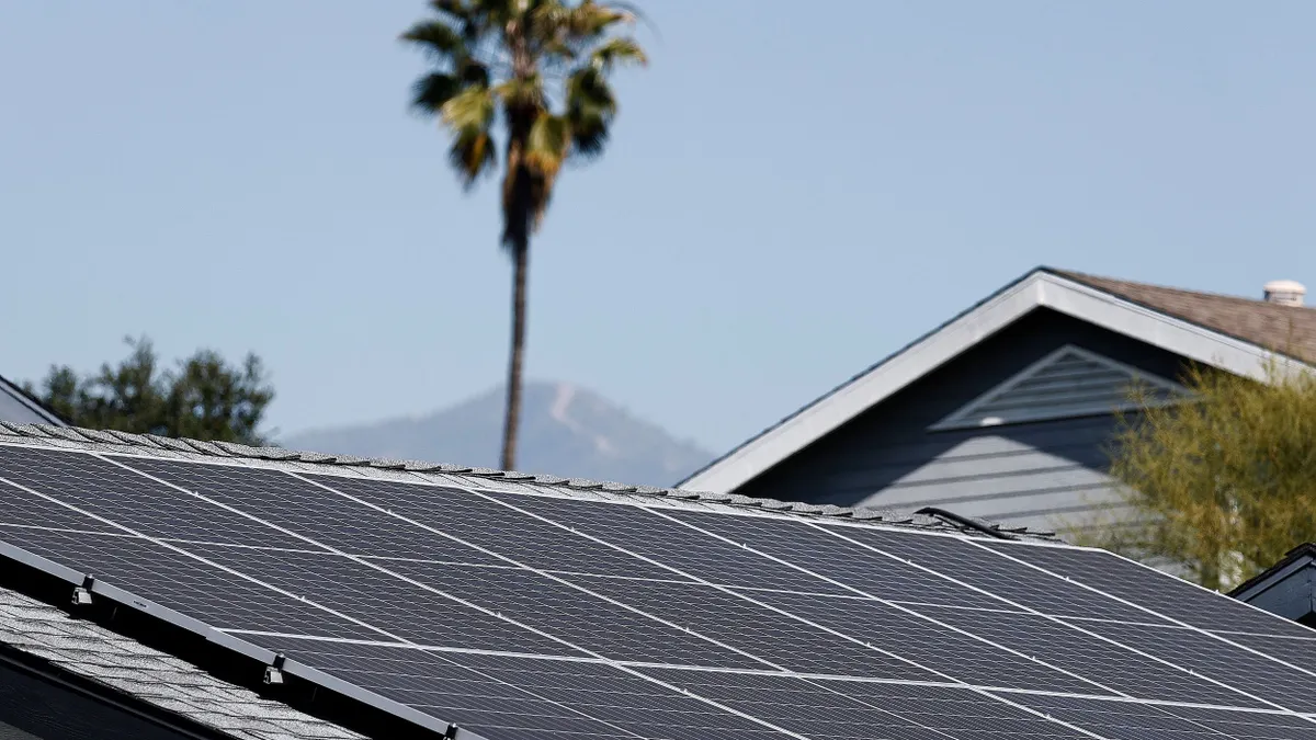 A view of solar panels atop the roof of a home