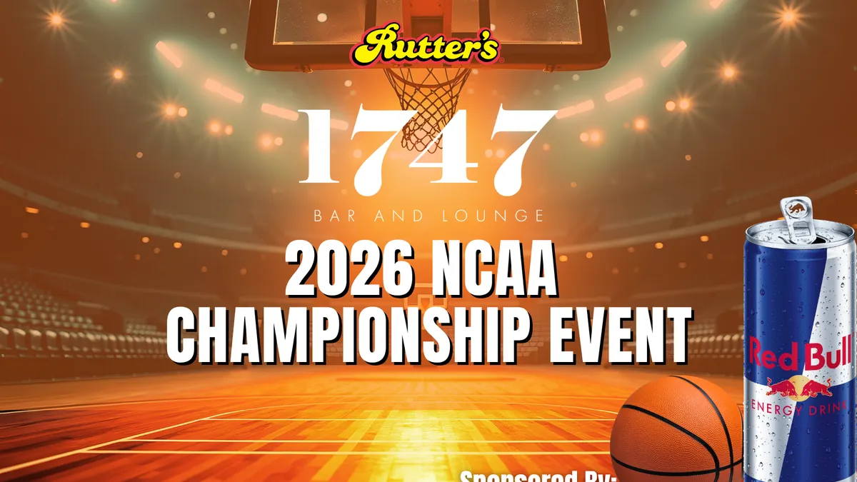 A photo of an empty basketball court surrounded by tiers of seating. Text over top of the image says "Rutter's 1747 Bar and Lounge 2026 NCAA Championship Event sponsored by Red Bull Energy Drink."