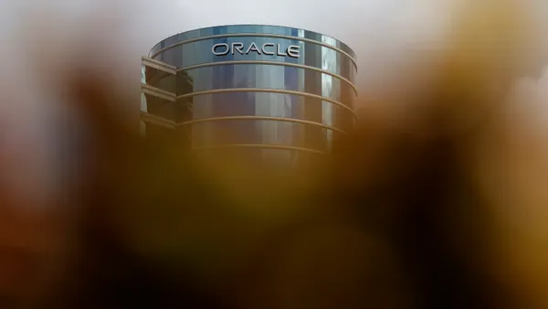 The Oracle logo is displayed on a building at an Oracle campus on September 10, 2025 in Redwood Shores, California.