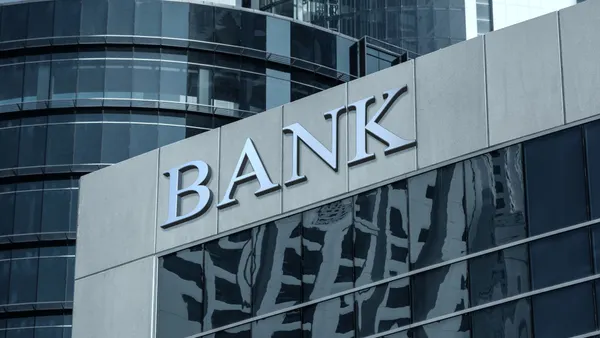 Bank sign on glass wall of business center