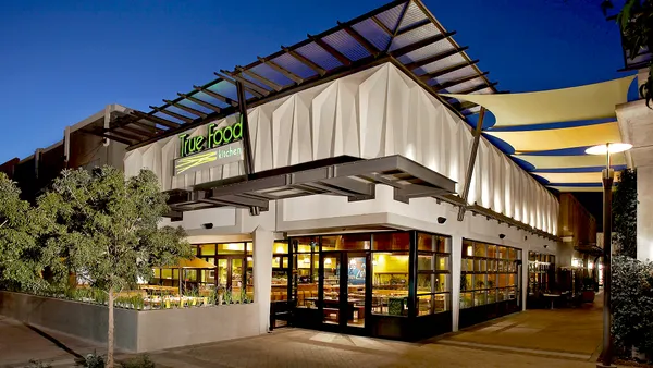 An evening photograph of a True Food Kitchen restaurant.