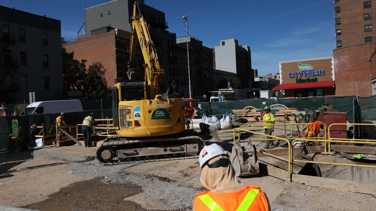 Workers are seen on the construction site of the Second Avenue subway station