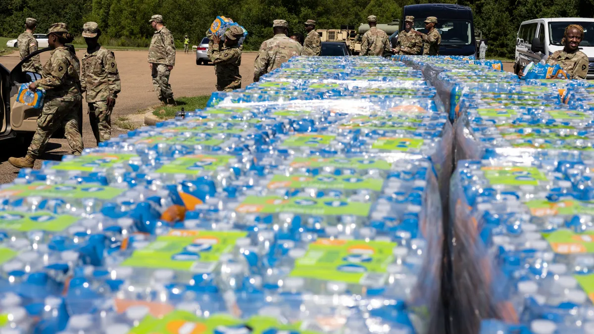 Members of the Mississippi National Guard hand out bottled water at a Jackson, Mississippi, middle school.