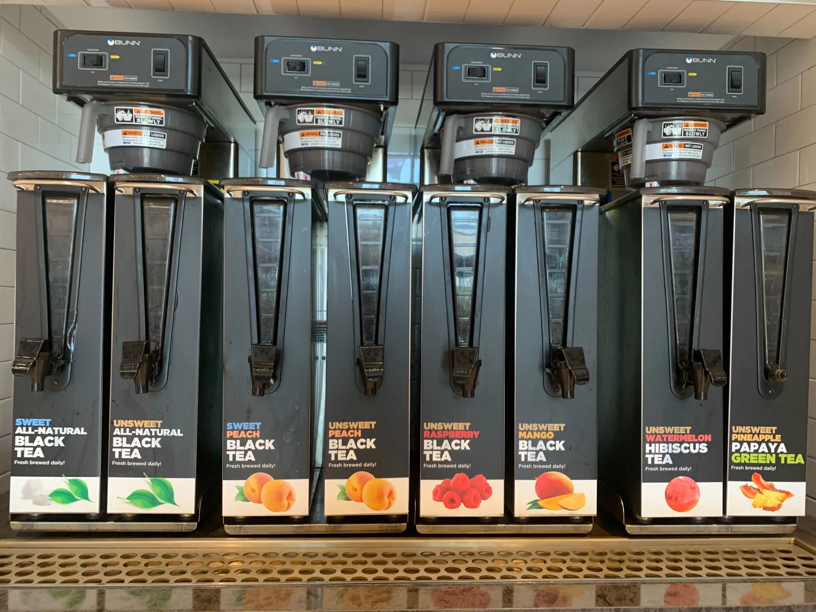 A photo of tea dispensers inside a TXB convenience store.