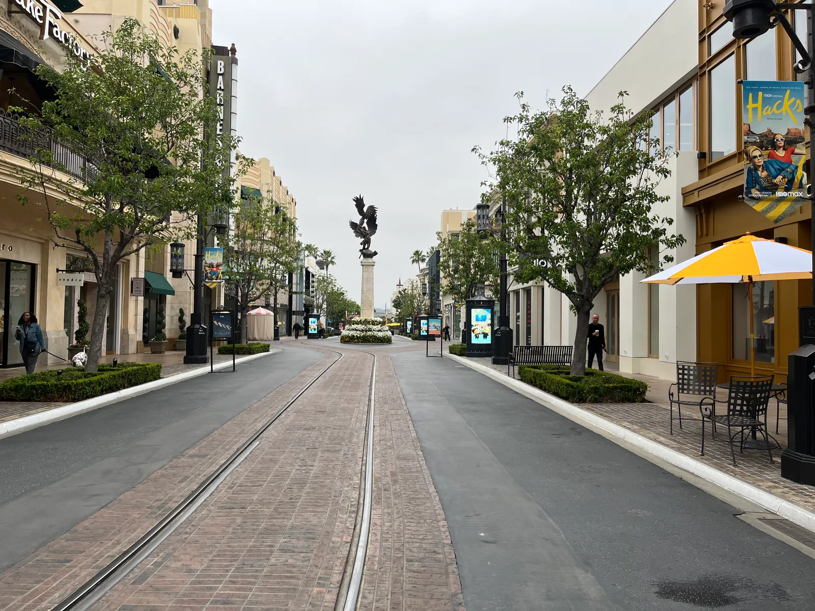 A store-lined street leading to a statue at The Grove shopping center in Los Angeles.