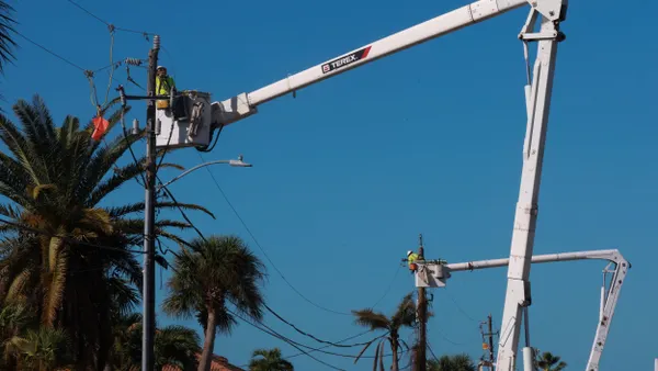 Linemen repair power lines