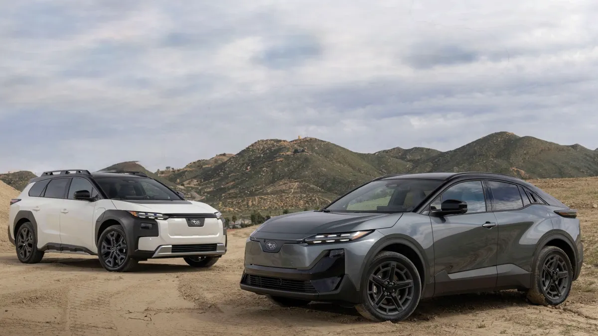 A 2026 Subaru Trailseeker and 2026 Subaru Uncharted are parked next to each other on a dirt off-road course in California.