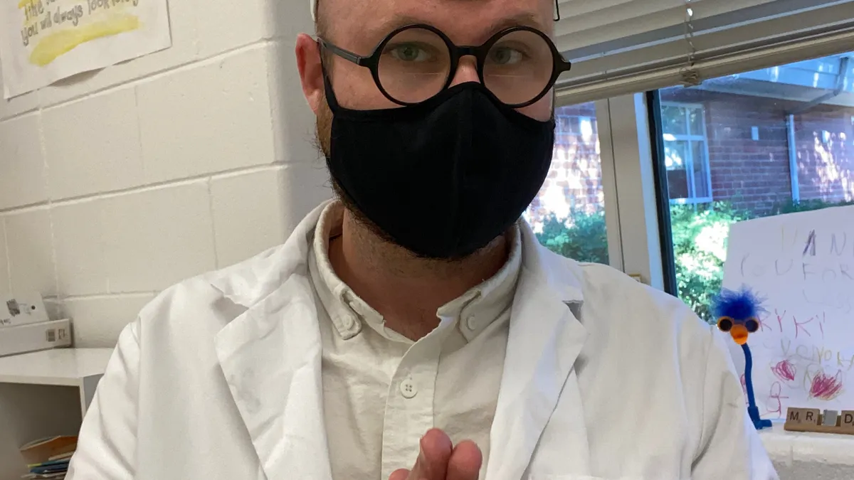 Kyle Dooley, a kindergarten teacher in Virginia Beach City Public Schools, dresses in white to teach his students about colors in the fall of 2020..