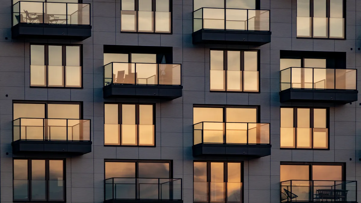 An apartment building at sunset.