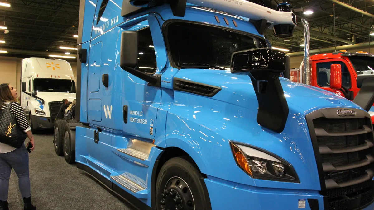 A Waymo Via truck inside a convention space of the Hilton Anatole in Dallas.