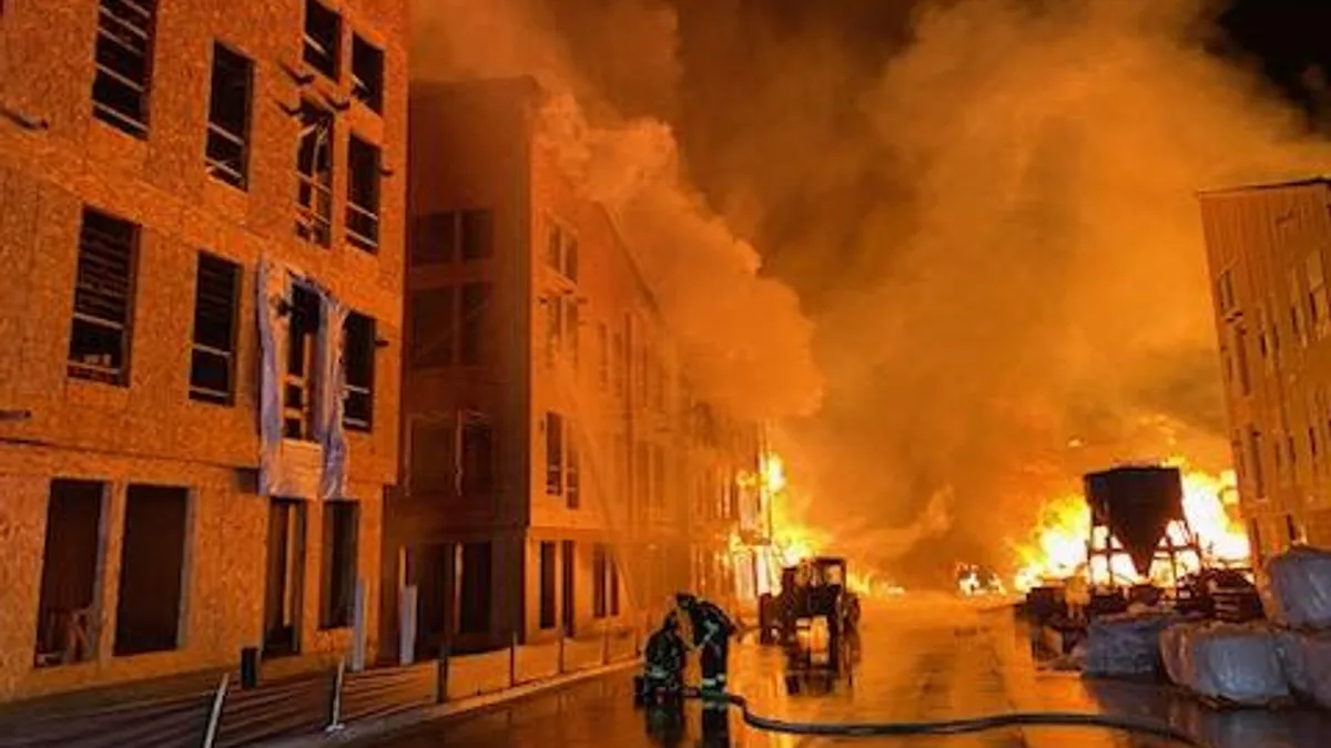 A building burns at night.