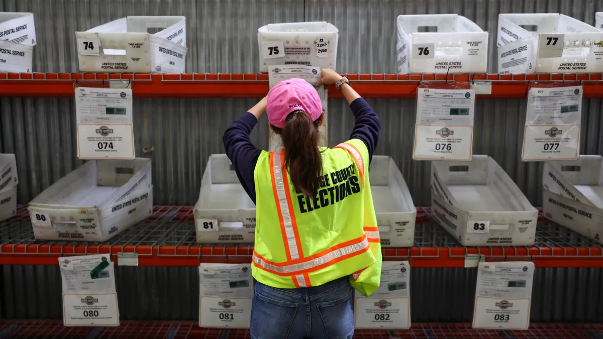 An election worker works at the Orange County Registrar of Voters less than two weeks before midterms Election Day on October 27, 2022 in Santa Ana, California.