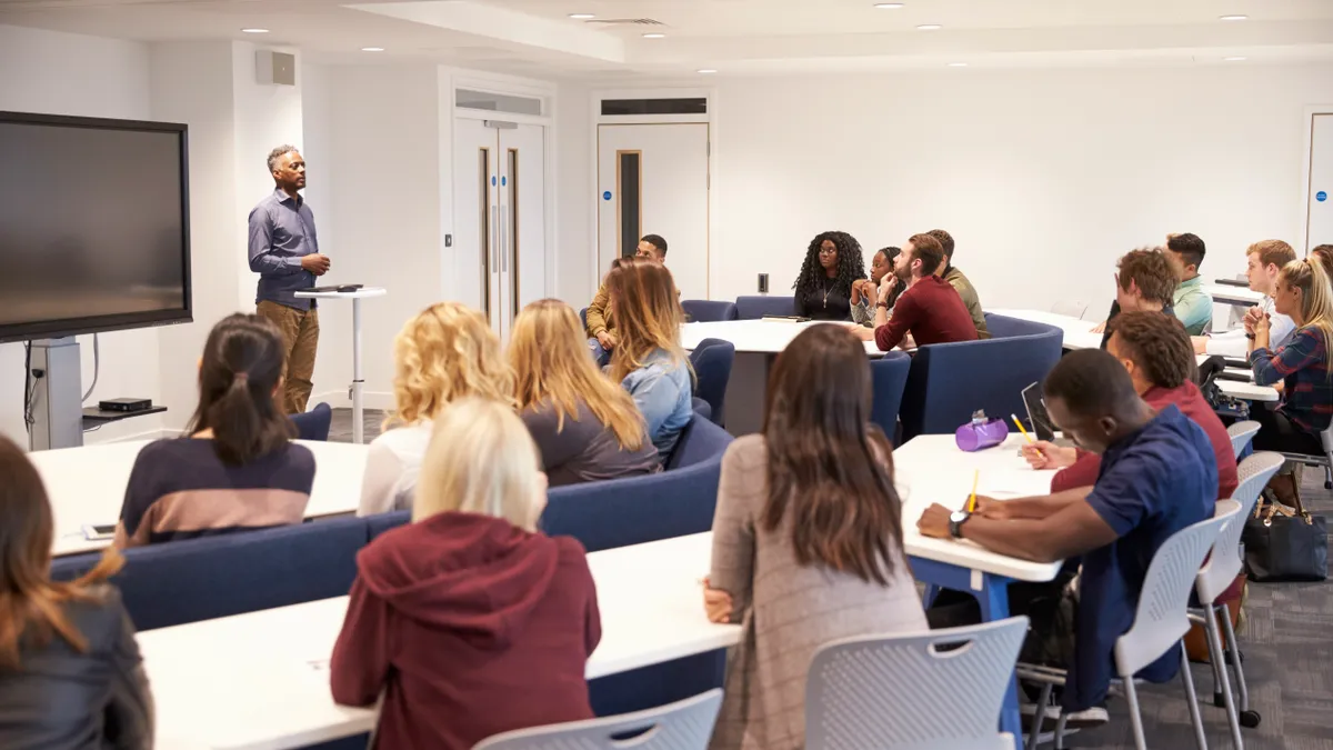 Professor teaching in a college classroom