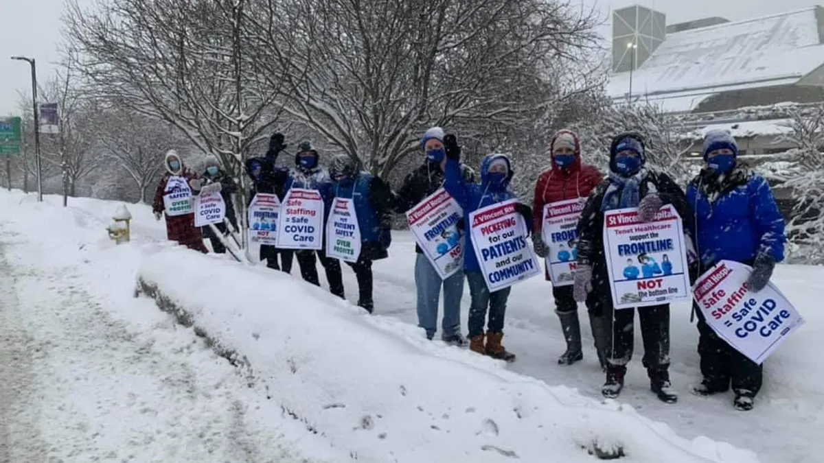 Nurses with the Massachusetts Nurses Association picketed over staffing concerns at St. Vincent Hospital in December.