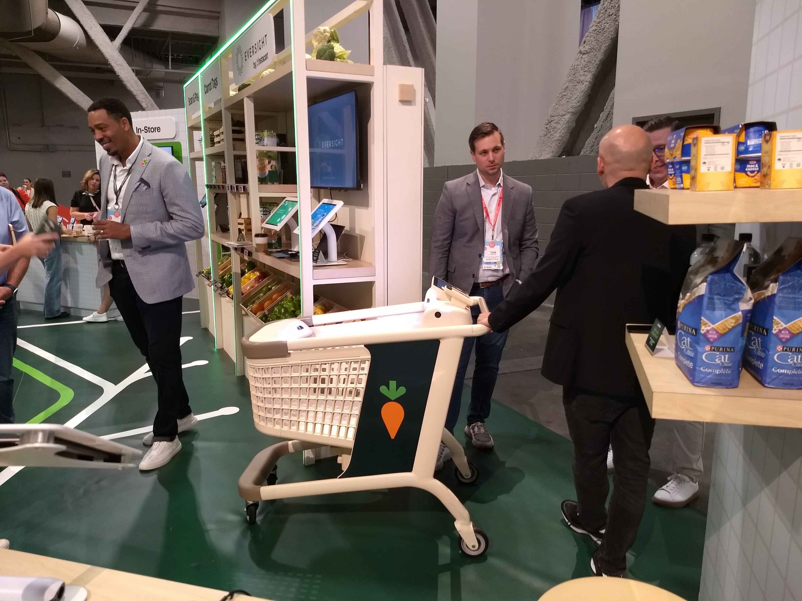 A smart grocery cart at an exhibit hall booth