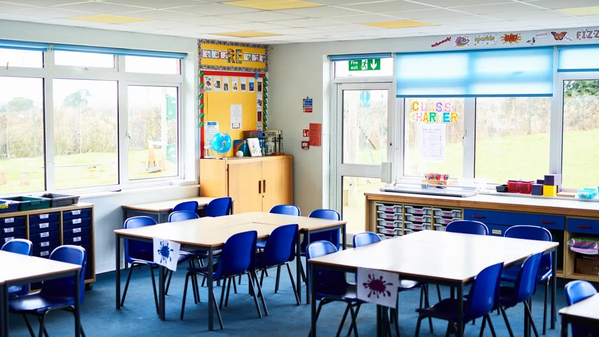 empty classroom with chairs and tables