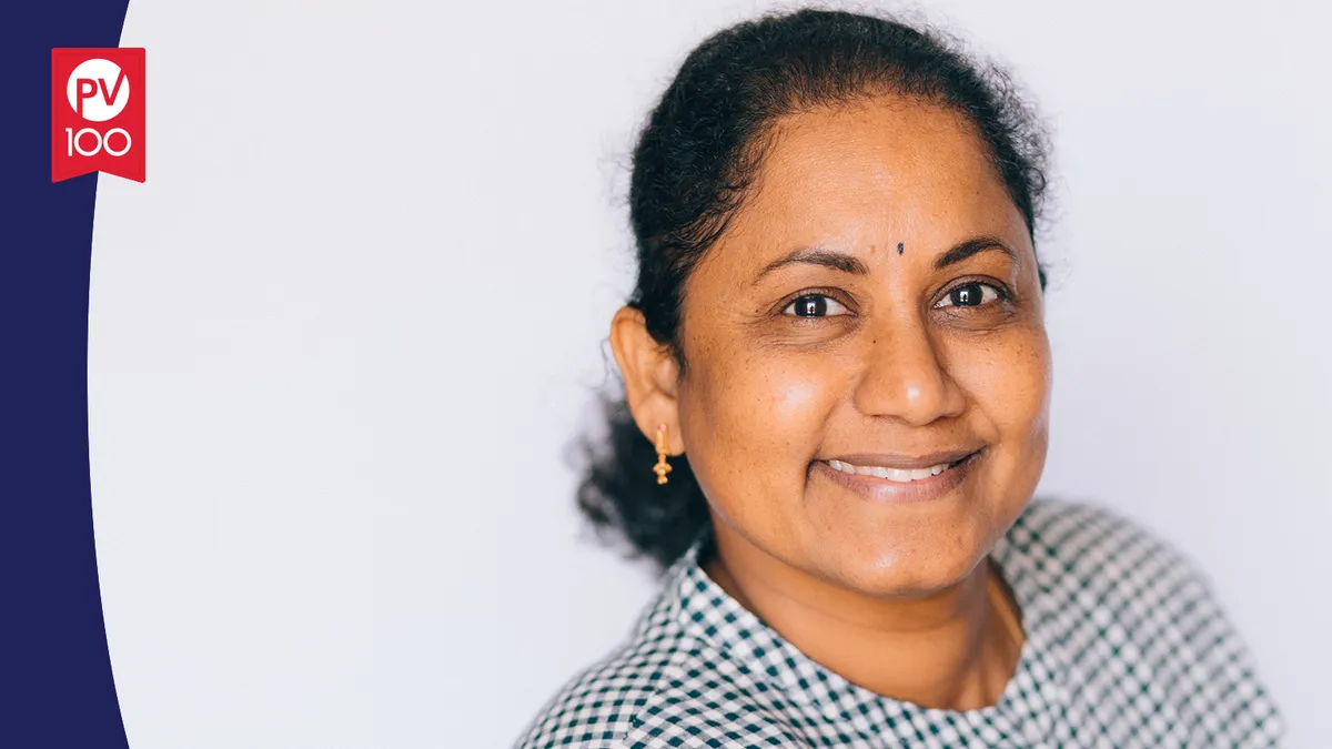 A portrait of Laxmi Bonagiri framed with a banner icon that reads "PV 100"