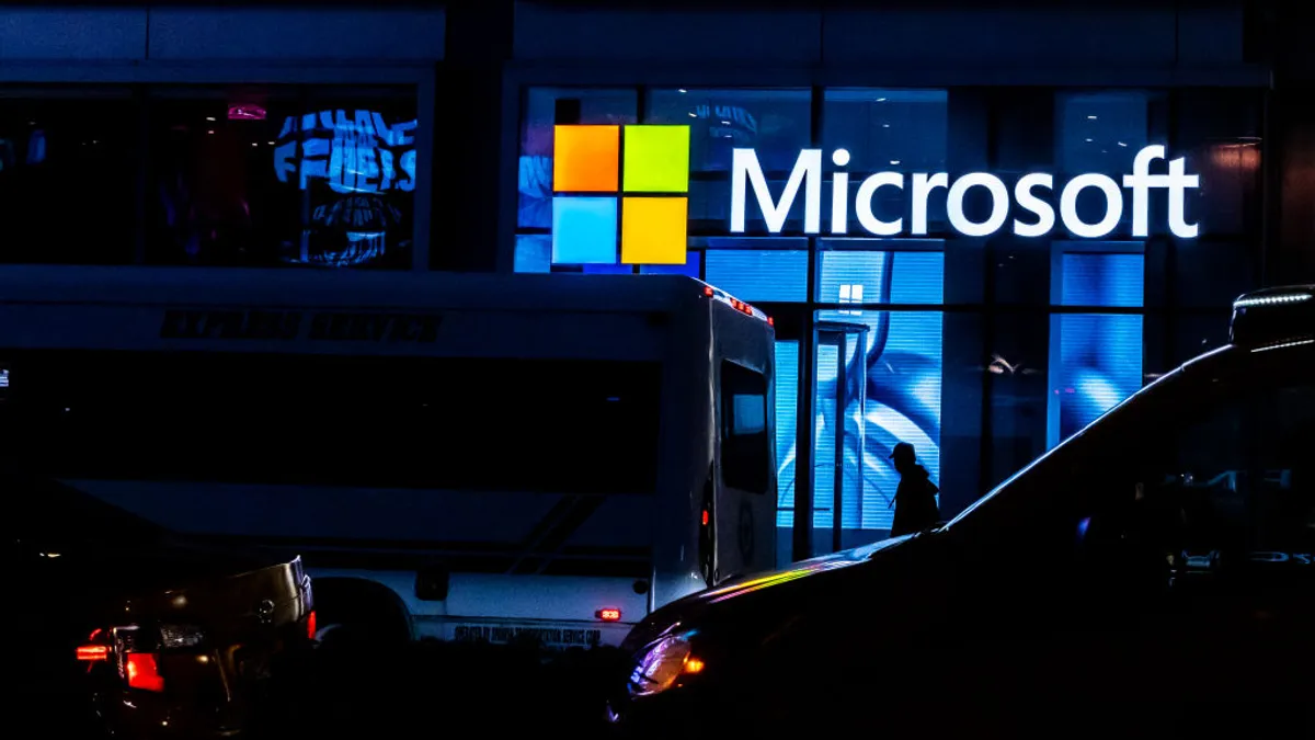 a microsoft storefront in a city nightscape