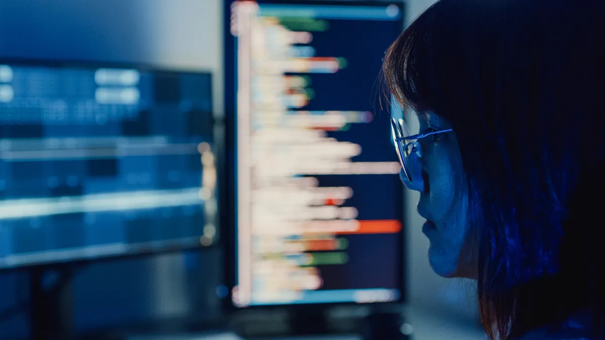 a worker looking at a screen