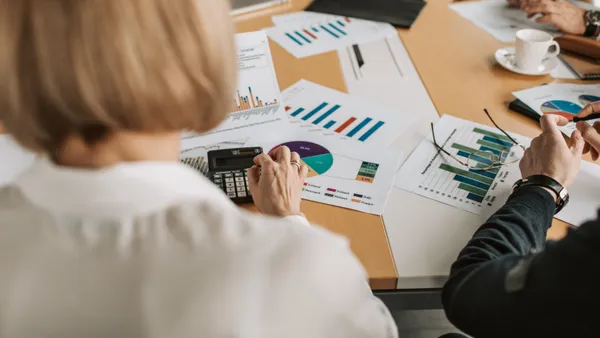 Woman doing paperwork in corporate office