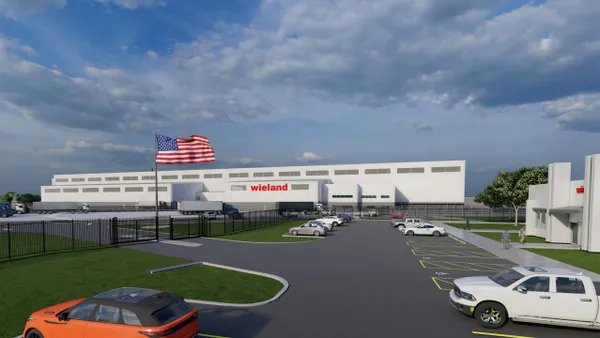 A rendering of an industrial facility that's framed from a parking lot.