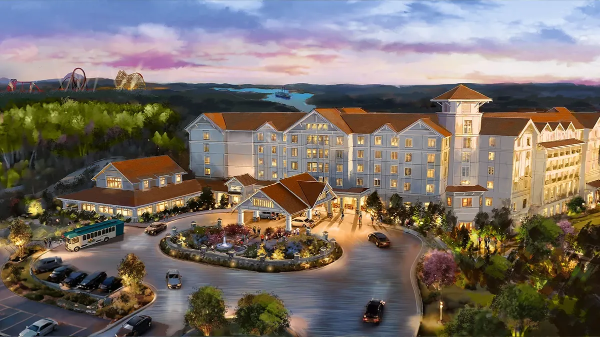 A rendering of the new Silver Dollar City resort, with cars driving through a roundabout in front of the structure.