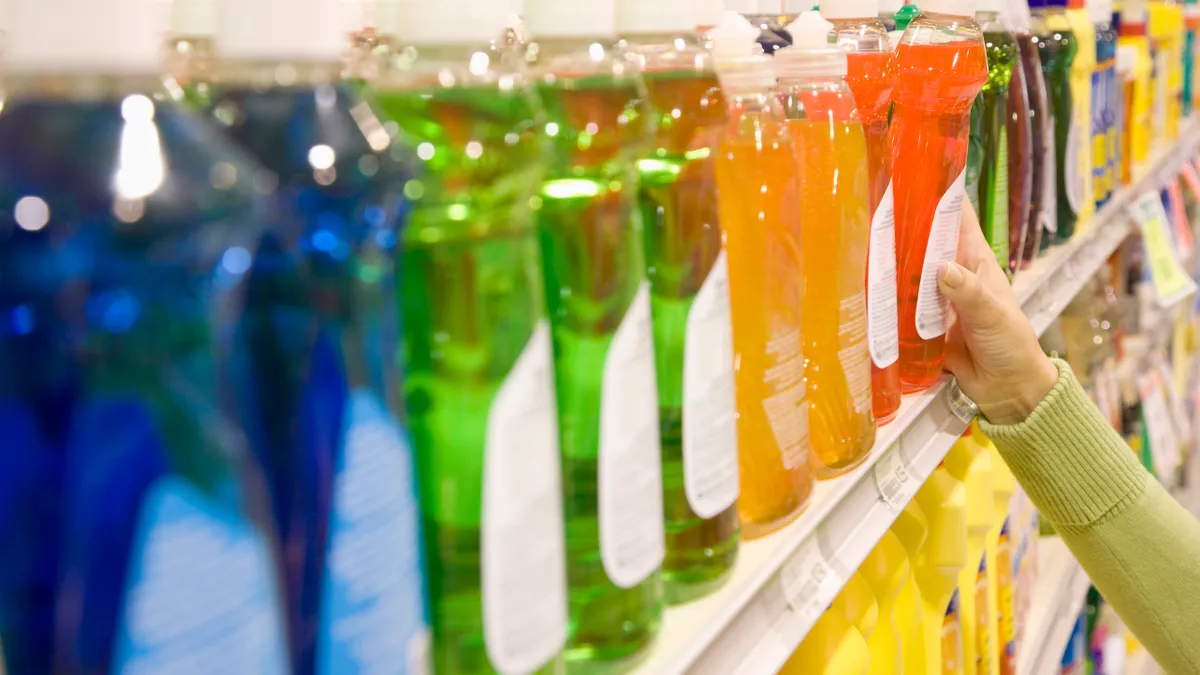 selecting dishwashing liquid product in supermarket