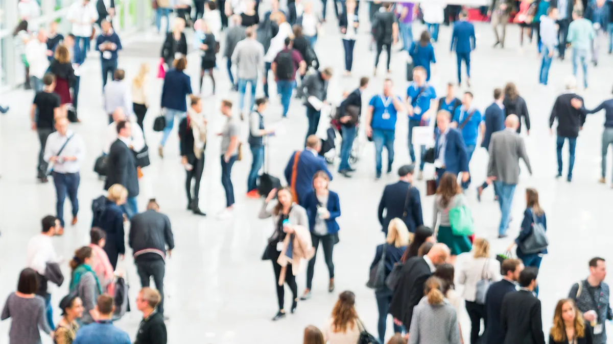 Blurred people in a modern hall